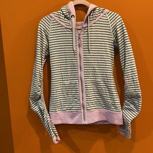 Lululemon size 6 reversible hoodie in pink or grey and black stripes with pink.